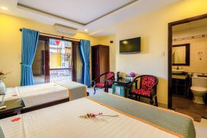 TV a/nebo společenská místnost v ubytování Golden River Hotel