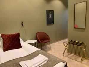 Ένα ή περισσότερα κρεβάτια σε δωμάτιο στο Hotell Esplanad