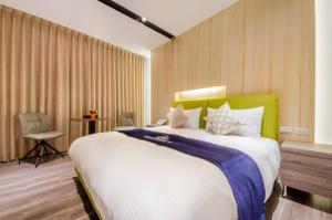 Voodi või voodid majutusasutuse Mucun Hot Spring Resort toas