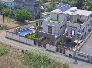 an aerial view of a house with a swimming pool at Mont Oreb Villas Ruby, Nothern coast Mauritius in Pereybere