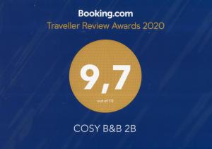 Majutusasutuses COSY B&B 2B olev sertifikaat, autasu, silt või muu dokument