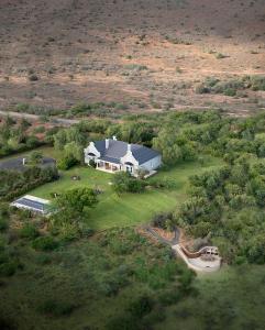 an overhead view of a large house in a field at Kwandwe Uplands Homestead in Grahamstown