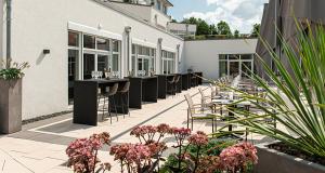 Ein Garten an der Unterkunft Victor's Residenz-Hotel Teistungenburg