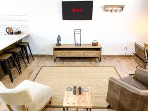 a living room with a couch and a table at Modern Farm in Lichtenburg