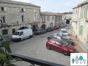 a group of cars parked on a city street at Appartement 4 Pers VERGEZE in Vergèze