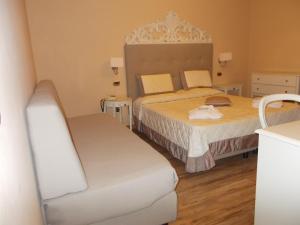 Postel nebo postele na pokoji v ubytování Hotel Manzoni Wellness&Spa