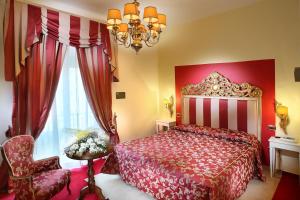 Postel nebo postele na pokoji v ubytování Hotel Manzoni Wellness&Spa