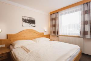 Posteľ alebo postele v izbe v ubytovaní Apart Pension Moos - inklusive SuperSommerCard