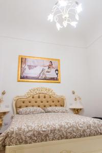 Postel nebo postele na pokoji v ubytování Palazzo Le Travi