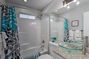 a bathroom with a sink and a toilet and a shower at Montrose Adventure Base Near Skiing and San Juans! in Montrose +37 photos