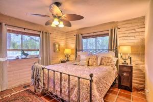 een slaapkamer met een bed en een plafondventilator bij Equestrian Estate with Horse Stables and Pool! in Valley Center +25 foto's