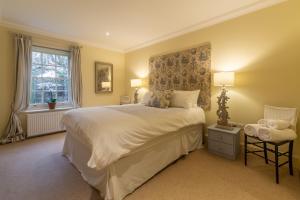 a bedroom with a large bed and a window at Higham Place Lodge in Higham