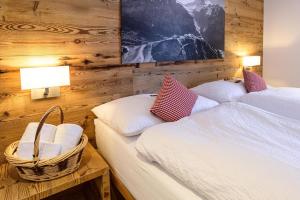 Ένα ή περισσότερα κρεβάτια σε δωμάτιο στο Hotel Bernerhof Grindelwald