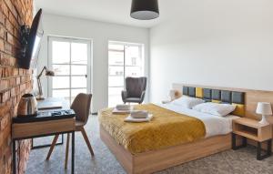Łóżko lub łóżka w pokoju w obiekcie ApartHOTEL Gostyń