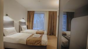 MER Guest House B&B客房内的一张或多张床位