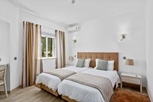 Ένα ή περισσότερα κρεβάτια σε δωμάτιο στο Prado Villas +22 φωτογραφίες