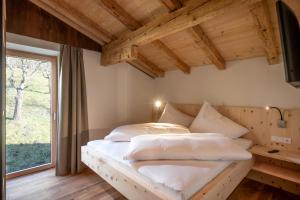 Łóżko lub łóżka w pokoju w obiekcie Apartments Zauberberg