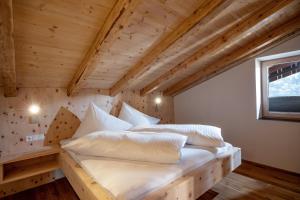 Łóżko lub łóżka w pokoju w obiekcie Apartments Zauberberg