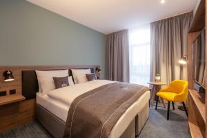 Ένα ή περισσότερα κρεβάτια σε δωμάτιο στο Holiday Inn - the niu, Loom Manchester North by IHG