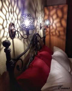 A bed or beds in a room at EVANS Skiathos