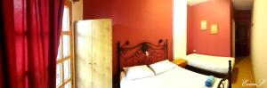 A bed or beds in a room at EVANS Skiathos