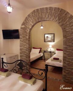 A bed or beds in a room at EVANS Skiathos