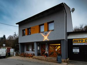 a building with a table in front of it at Apartmán U Křížku in Jihlava