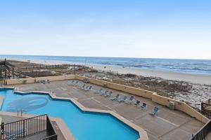 a view of a swimming pool and the beach at Phoenix II #2023 in Orange Beach