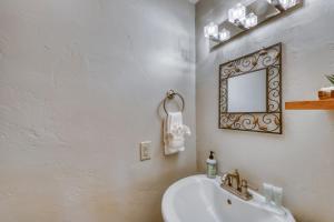 a bathroom with a sink and a mirror on the wall at Pitkin Outpost in Frisco +14 photos