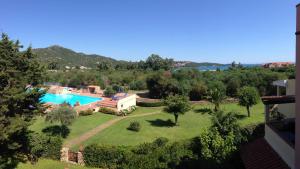 an aerial view of a resort with a swimming pool at Sardegna Beach Eucalyptus in Golfo Aranci