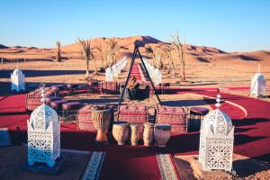 a group of baskets on a table in the desert at Luxury Desert Camp Amanar in Merzouga