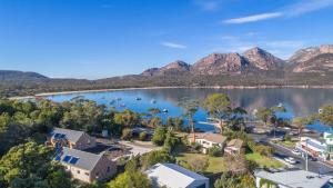 an aerial view of a lake with mountains in the background at Freycinet Stone Studio 7 - Quartz in Coles Bay