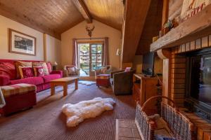 a living room with a dog laying on the floor at Bel Appartement spacieux 65m2 Les Arcs 1950 in Arc 1950