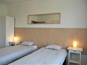 Posteľ alebo postele v izbe v ubytovaní Apartamenty Dobranoc - Wawer 2