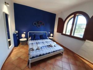 Postel nebo postele na pokoji v ubytování Spazioso appartamento con terrazza a due passi dal centro