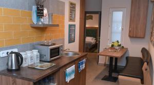 Kuchyňa alebo kuchynka v ubytovaní Portré Apartman