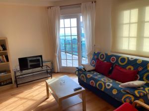 Χώρος καθιστικού στο apartamestos beach Langosteira