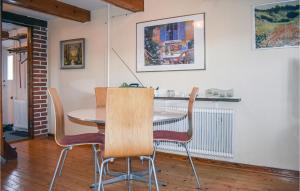 a dining room with a table and chairs at Lovely Apartment In Rydebck With Kitchen in Rydebäck