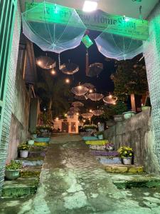 a hallway with umbrellas hanging from the ceiling at RiverView HomeStay in Dong Hoi