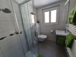 Koupelna v ubytování Apartmenthaus Holiday