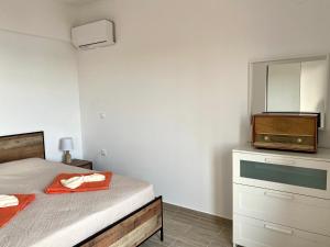 Postel nebo postele na pokoji v ubytování Coralli Pentati 2 "Dimitris Apartments"