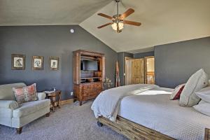 a bedroom with a bed and a ceiling fan at Grand Lake Getaway Walk to Shadow Mountain Lake! in Grand Lake