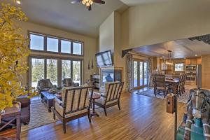 a living room filled with furniture and a tv at Grand Lake Getaway Walk to Shadow Mountain Lake! in Grand Lake