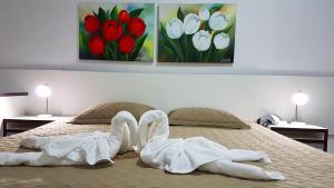 Postel nebo postele na pokoji v ubytování Hotel Termas Gravatal