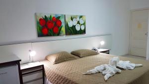 Postel nebo postele na pokoji v ubytování Hotel Termas Gravatal + 37 fotografií