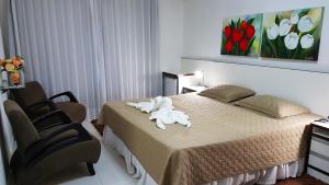 Postel nebo postele na pokoji v ubytování Hotel Termas Gravatal