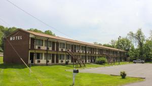a large building with a lot of windows at Green Valley Motel Winston Salem in Winston-Salem
