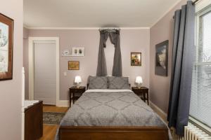 a bedroom with a bed and two night stands at Ringling House Bed & Breakfast in Baraboo