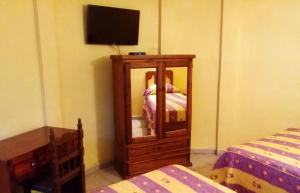 Postel nebo postele na pokoji v ubytování Hotel Quinta San Juan