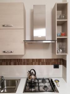 Virtuvė arba virtuvėlė apgyvendinimo įstaigoje Appartamento"Alba" locazione turistica